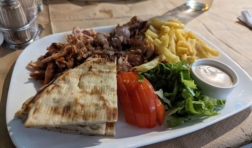 A picture of a chicken gyros (γύρος) platter